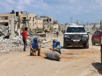 UN specialists inspect unexploded ordnance following the withdrawal of Israeli troops from Khan Younis city, on 10 April 2024. Photo by OCHA/Themba Linden