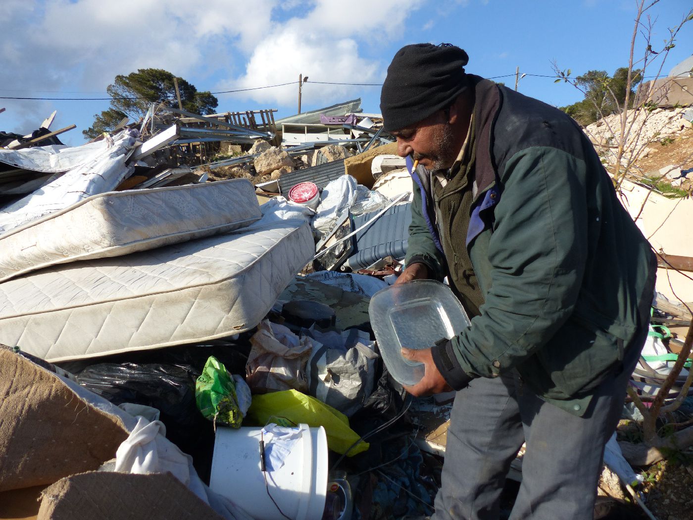 Salem from Jabal al Baba between the rubble of his demolished house , January 2017. © Photo by OCHA