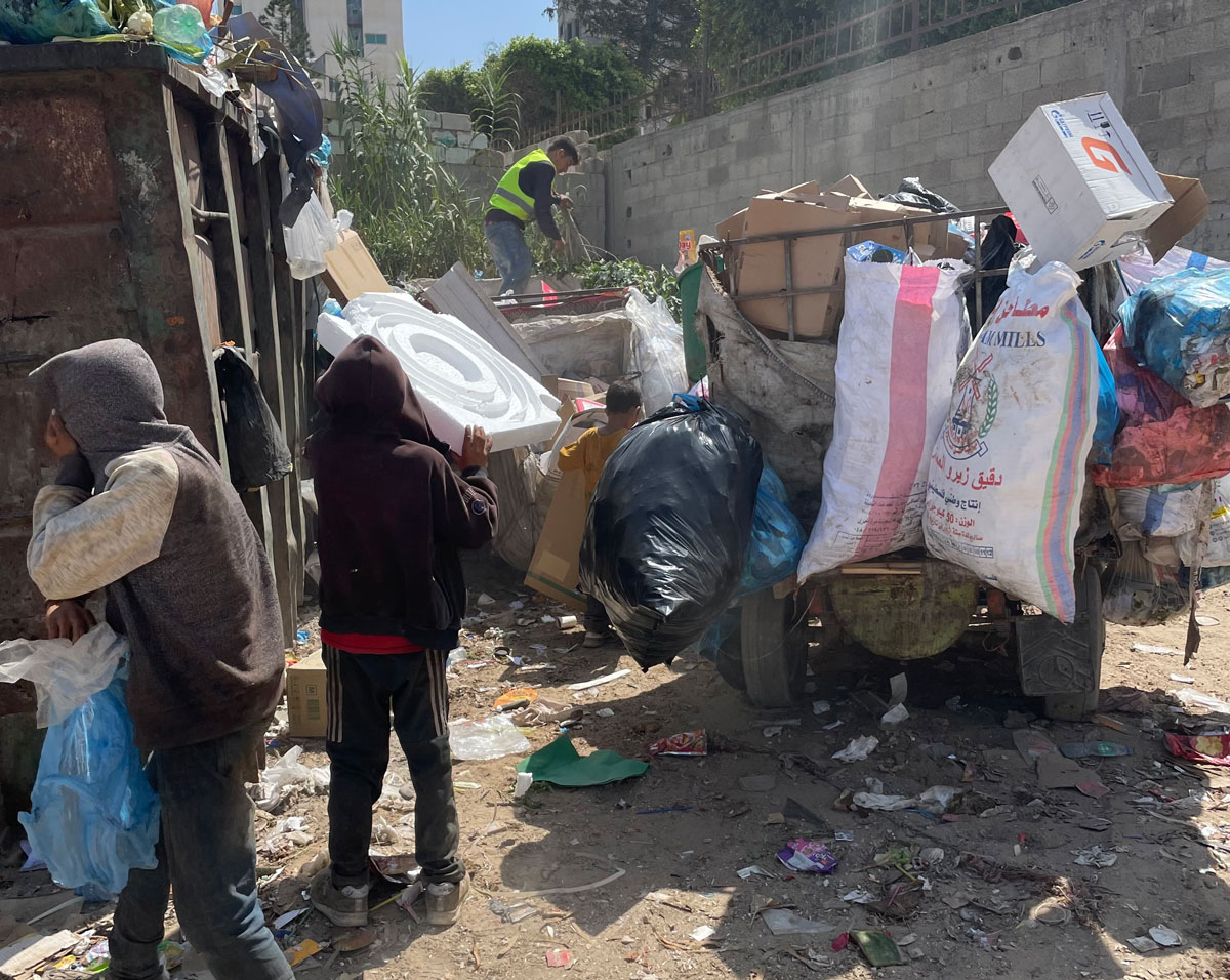 Children in Gaza city collecting metal and plastic to sell. Scrap iron and aluminum are among the few types of commodities allow