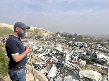 Palestinian observing his destroyed property following the demolition of 12 structures by Israeli forces in Az Za’ayyem Bedouin community, Jerusalem, on 3 March 2025. Photo by OCHA