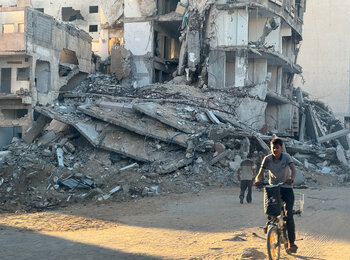 A Palestinian child riding his bicycle in Gaza city on 17 September 2024. Photo by OHCHR/Olga Cherevko