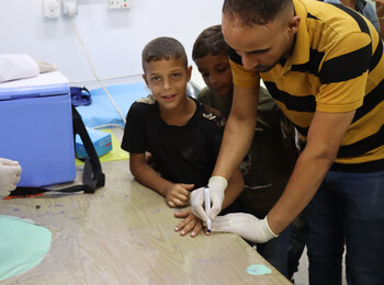 Vaccinating children for polio in Gaza. Photo by OCHA/Themba Linden