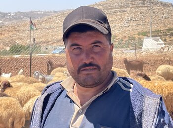 Ammar Abu ‘Alia, resident of Ras al Tin who left with his family in recent days. This photo was taken where he is currently staying with relatives, guarding his herd. Photo by OCHA, 9 August 2023