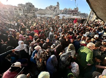 Amid desperate conditions, people queue for bread outside one of the few UN-supported bakeries still operating in Gaza. Photo by UNRWA