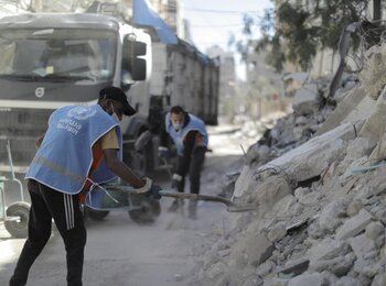 UNRWA sanitation workers clearing rubble, June 2021 © By Mohamed Hinnawi /UNRWA