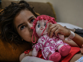 “Before the war, I managed our school’s radio station,” says eight-year-old Shaimaa who lost her foot and her hand when a nearby house was struck during hostilities, “I dream of becoming a journalist, to document the attacks against children.” Photo by UNICEF/Zaqout