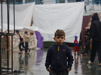 A 6-year-old displaced boy in southern Gaza, where heavy rains have worsened the already dreadful living conditions of people staying outdoors, adding to the risk of waterborne diseases. Photo by UNICEF/El-Baba, 6 December 2023
