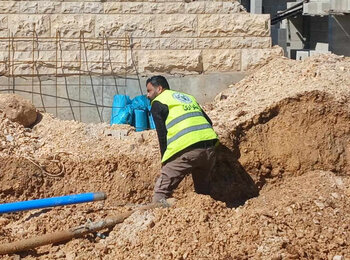 A Jenin Municipality worker repairs a water line damaged by bulldozers in Birqin, 15 February 2025. Photo by Jenin Municipality 