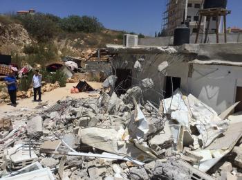 Demolition of an extension of a house in Beit Hanina, East Jerusalem, on 26 June. Photo by OCHA.