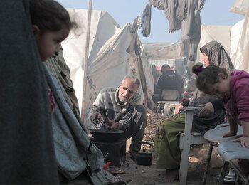 A displaced family in the Gaza Strip. On 12 January, the UN Emergency Relief Coordinator Martin Griffiths warned that “more and more people are being crammed into an ever-smaller sliver of land, only to find yet more violence and deprivation, inadequate shelter and a near absence of the most basic services.” Photo by UNRWA