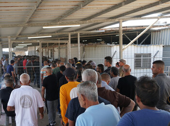 Palestinian workers at Erez crossing. Photo by OCHA