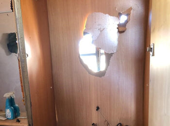 Damaged door from Umm Fagarah settler attack. ©Photo by OCHA