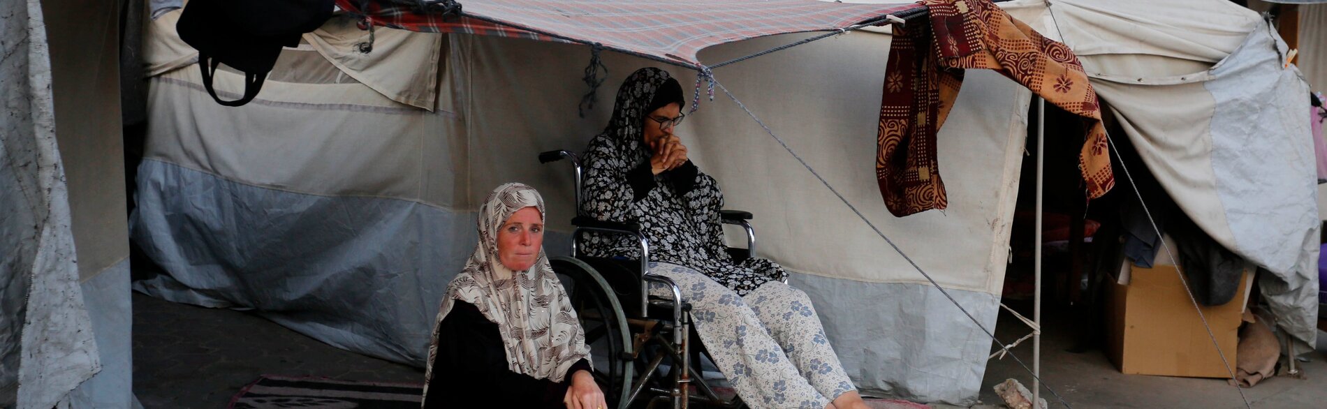 Displaced Palestinian women staying in an improvised shelter in Gaza. Photo by UNRWA 