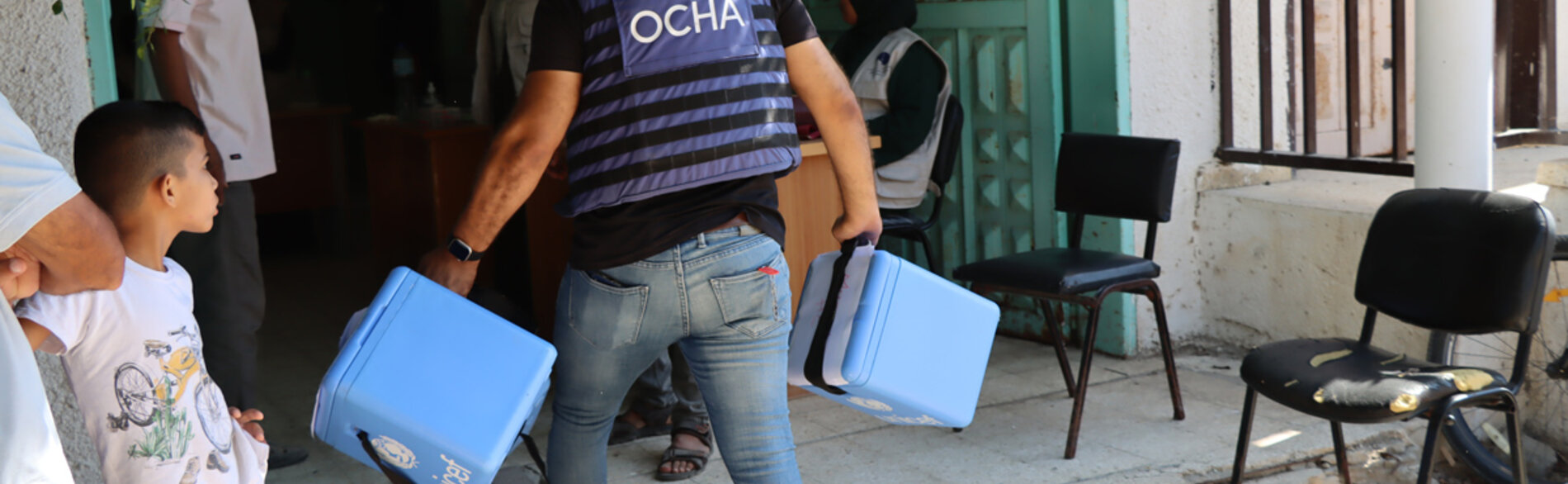 An OCHA staff member dispatching polio vaccines in Deir al Balah area of the Gaza Strip. Photo by OCHA/Themba Linden, 2 September 2024