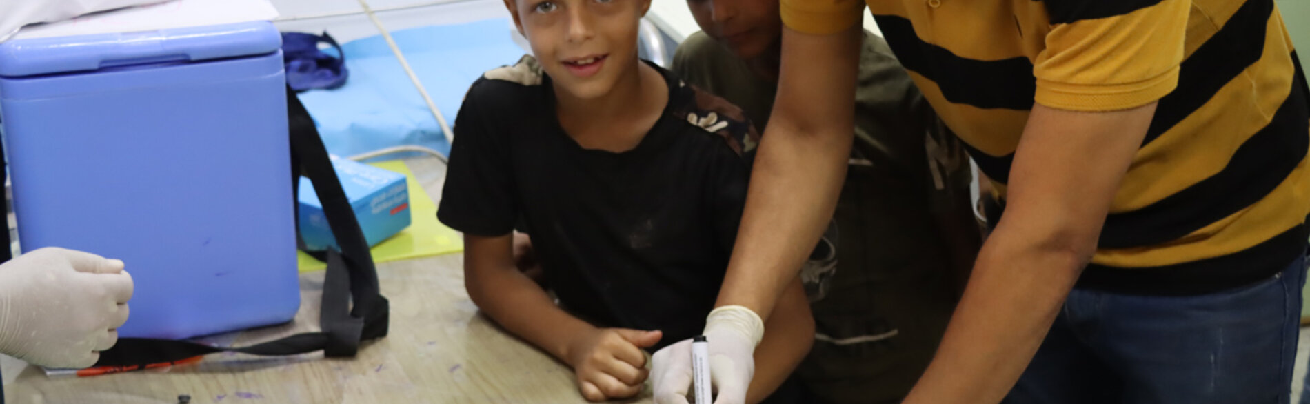 Vaccinating children for polio in Gaza. Photo by OCHA/Themba Linden