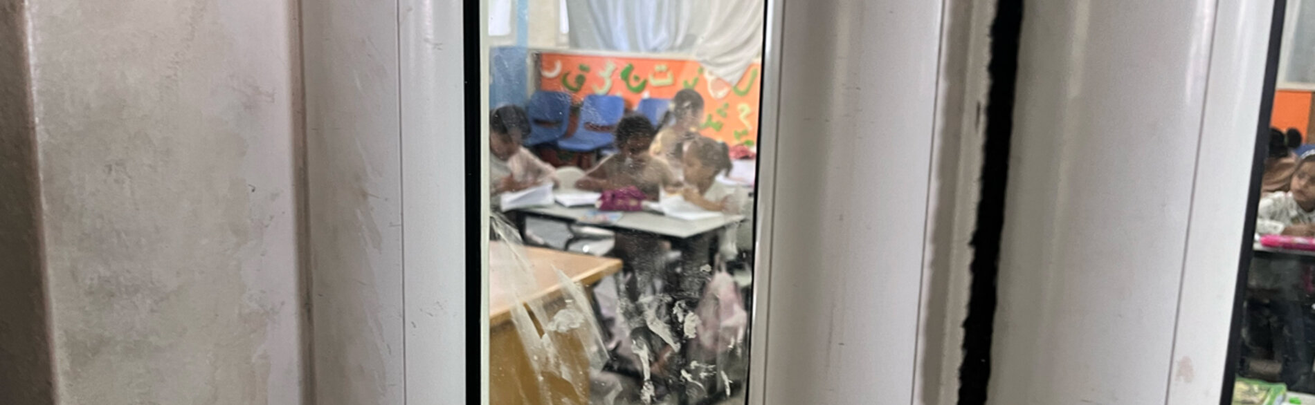 Children benefitting from informal learning activities in a school-turned-shelter in Al Maghazi refugee camp, in Deir al Balah. Teaching is focused on essential literacy and numeracy skills. Photo by OCHA 