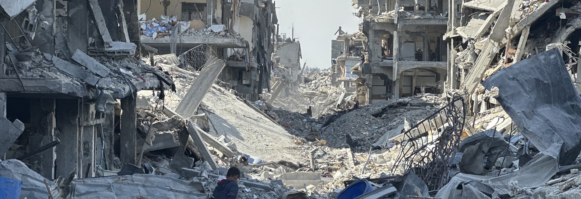 A boy amid ruins in Jabalya in North Gaza, 2 February 2025. Photo by OCHA/Olga Cherevko