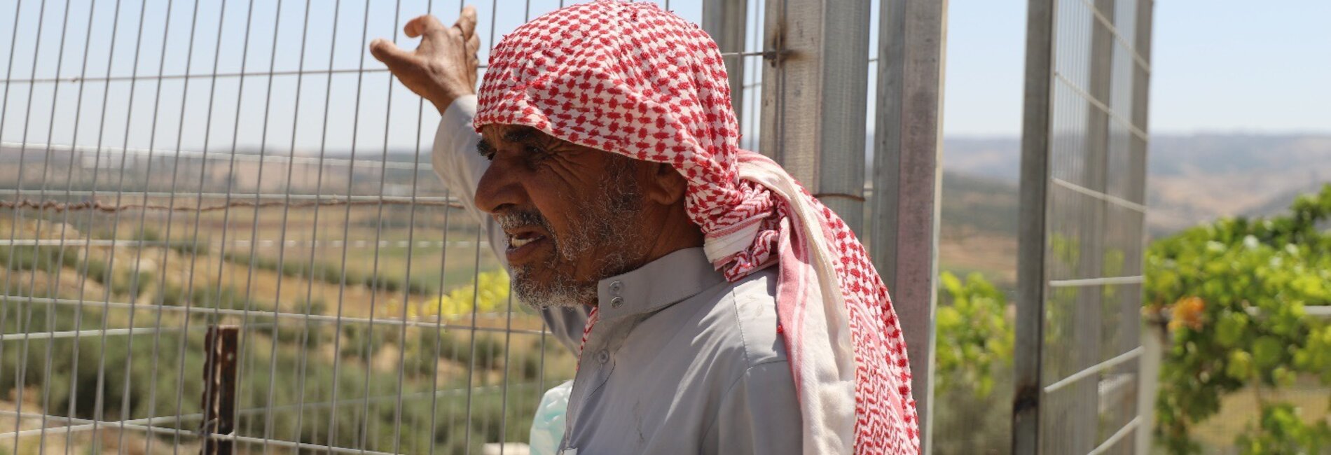 Abu Waleed, farmer and leader of the Queela community, near his house. Photo: ACF