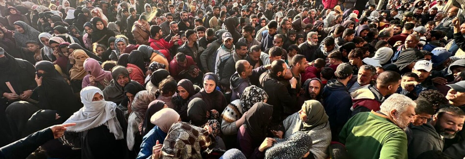 Amid desperate conditions, people queue for bread outside one of the few UN-supported bakeries still operating in Gaza. Photo by UNRWA