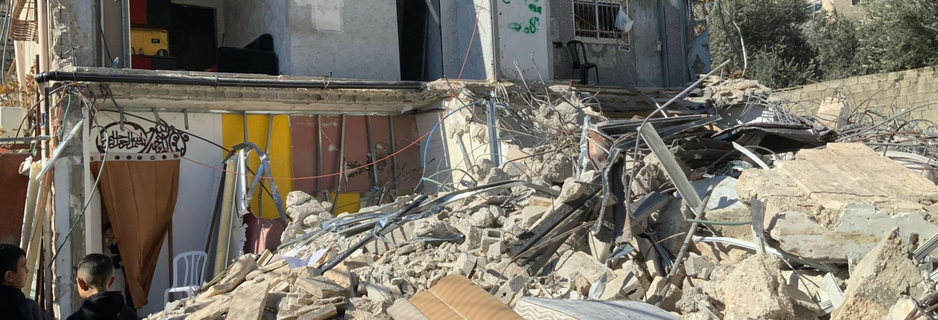 A two-storey residential building demolished by its Palestinian owners due to the lack of an Israeli-issued building permit, in Silwan, East Jerusalem. Six households, comprising 39 people were displaced. 5 January 2025.Photo: OCHA.