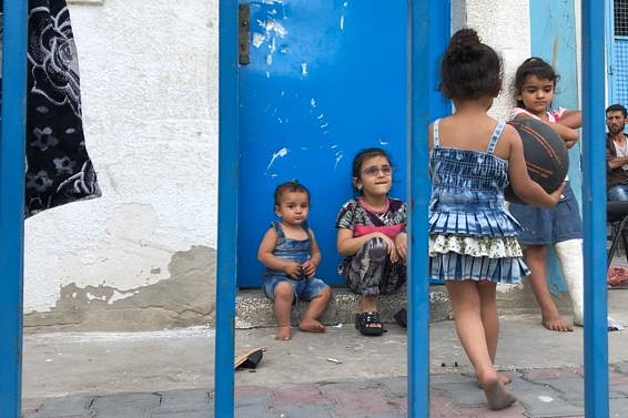 An internally displaced Palestinian family staying in and UNRWA-run school in Gaza, 14 April 2021. Photo by OCHA 